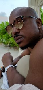 Portrait of young man wearing sunglasses