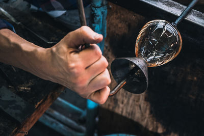 Manual worker making glass at workshop