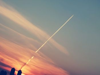 Low angle view of vapor trails in sky