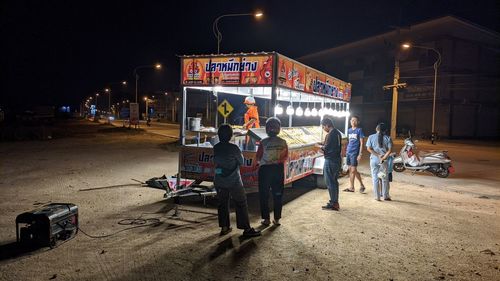 People on street in city at night