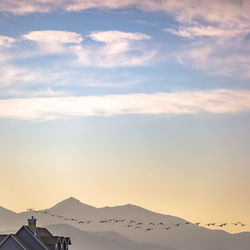 Scenic view of mountains against sky during sunset