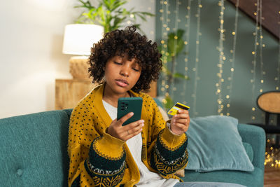 Young woman using mobile phone