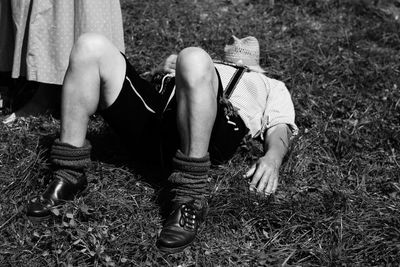 Man sleeping on grassy field