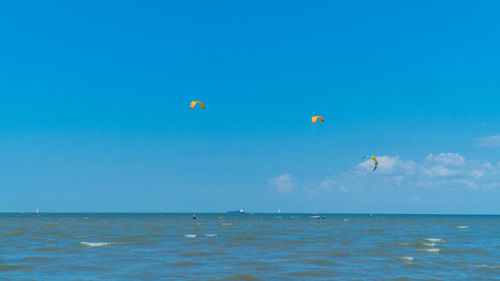 Scenic view of sea against blue sky