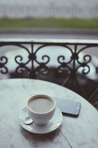 Close-up of coffee cup on table