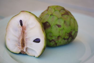 Close-up of fruit in plate on table