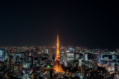 Illuminated buildings in city at night