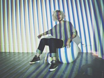 Full length of woman standing by railing