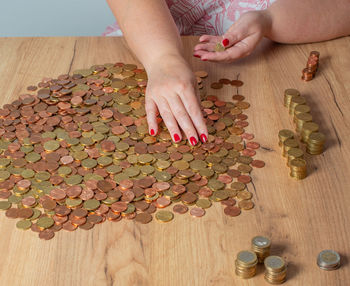 Cropped hands of person playing on table