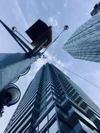 Low angle view of skyscraper against sky 