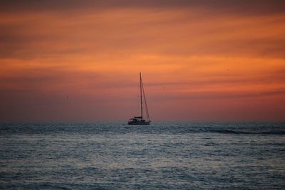 Lone boat in calm sea against the sky