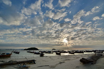 Scenic view of beach against sky during sunset