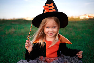 Portrait of a smiling girl on field