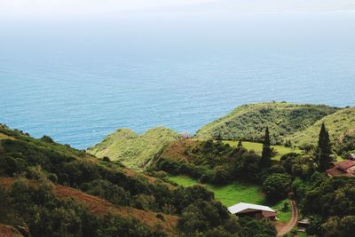 High angle view of trees and sea against sky