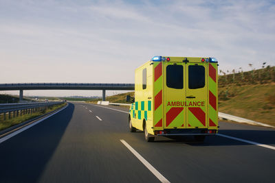 Fast moving ambulance car of emergency medical service on highway. 