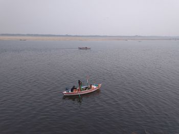 High angle view of boat in sea against sky