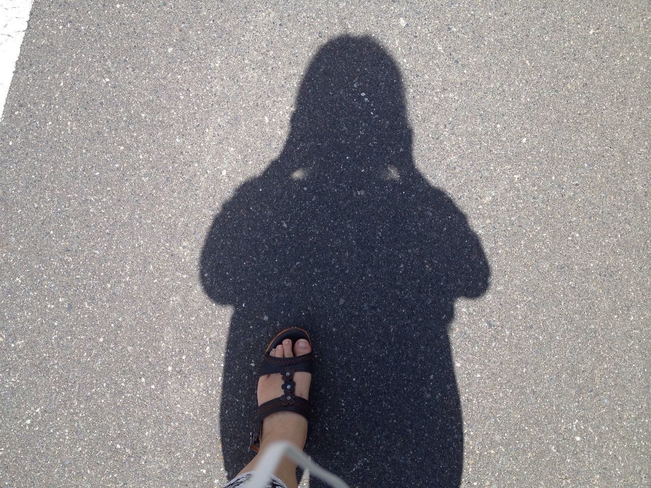 low section, person, shadow, standing, high angle view, personal perspective, footwear, human foot, shoe, part of, outdoors, day, fragility
