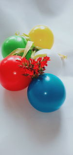 High angle view of multi colored balloons on table