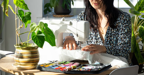 Midsection of woman working at table