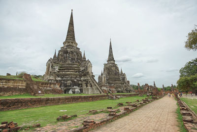 View of old temple building against sky