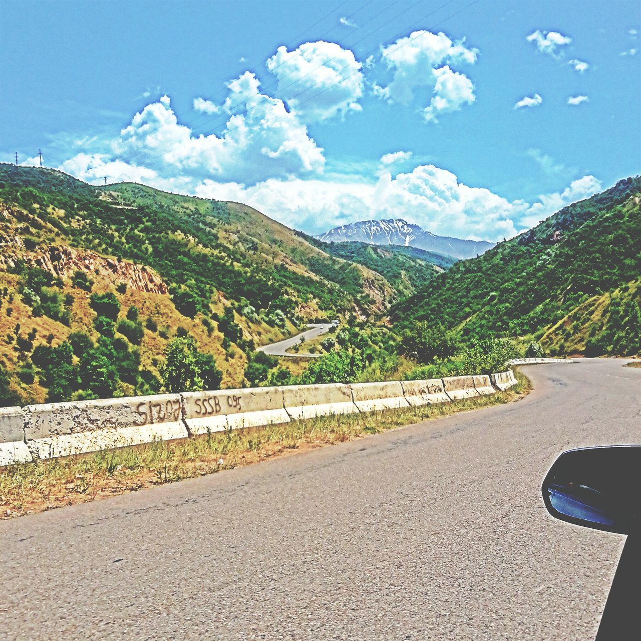 mountain, road, road marking, transportation, sky, the way forward, mountain range, country road, street, landscape, tranquility, asphalt, tree, scenics, nature, tranquil scene, beauty in nature, cloud - sky, empty road, cloud