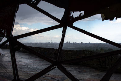 Close-up of cityscape against cloudy sky