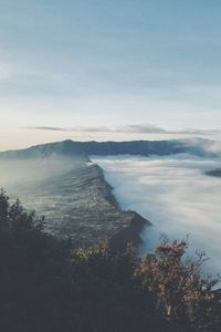 Scenic view of landscape and mountains against sky