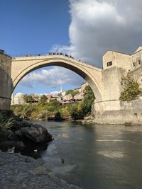 Bridge over river against sky