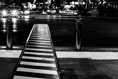 View of illuminated street lights at night