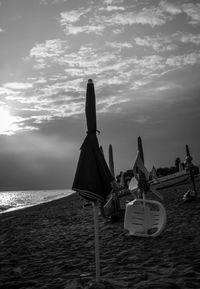 Built structure on beach against sky