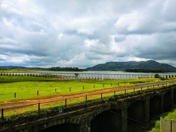 Scenic view of bridge over landscape against sky