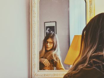 Portrait of young woman at home