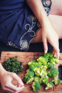 Midsection of man preparing food on cutting board