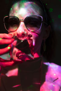 Close-up portrait of woman wearing sunglasses