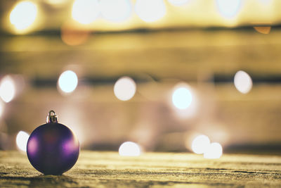 Close-up of christmas lights on table
