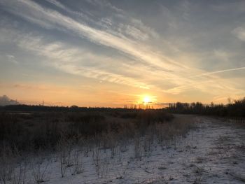 Scenic view of landscape against sky during sunset