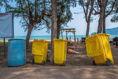 Panoramic view of yellow playground against clear blue sky