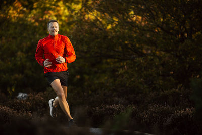 Smiling man jogging