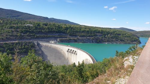 High angle view of dam by river against sky