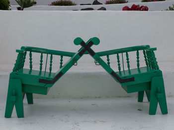 Empty benches in park during winter