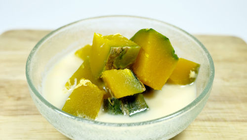 Close-up of chopped fruit in bowl on table