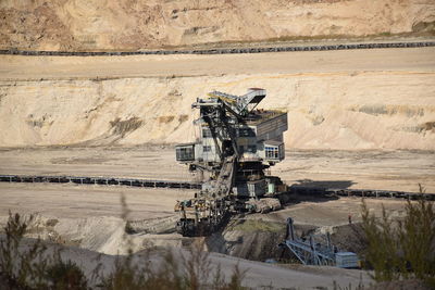 Big excavator digging on polish coal mine