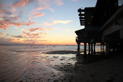 Scenic view of beach against sky during sunset