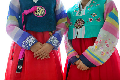 Midsection of women wearing traditional korean wedding dresses