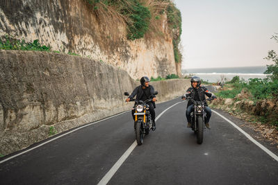 Man riding motorcycle on road