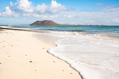 Scenic view of beach against sky