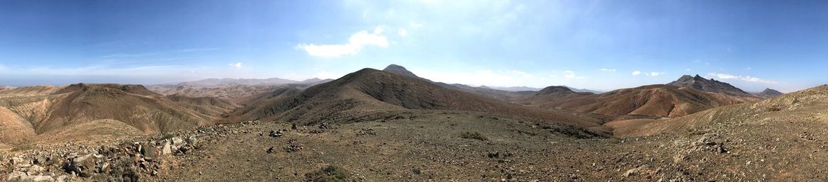 Panoramic view of desert against sky