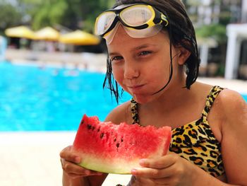 Portrait of girl eating watermelon