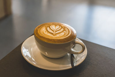 Close-up of cappuccino on table