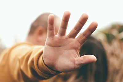 Cropped image of hand against white background